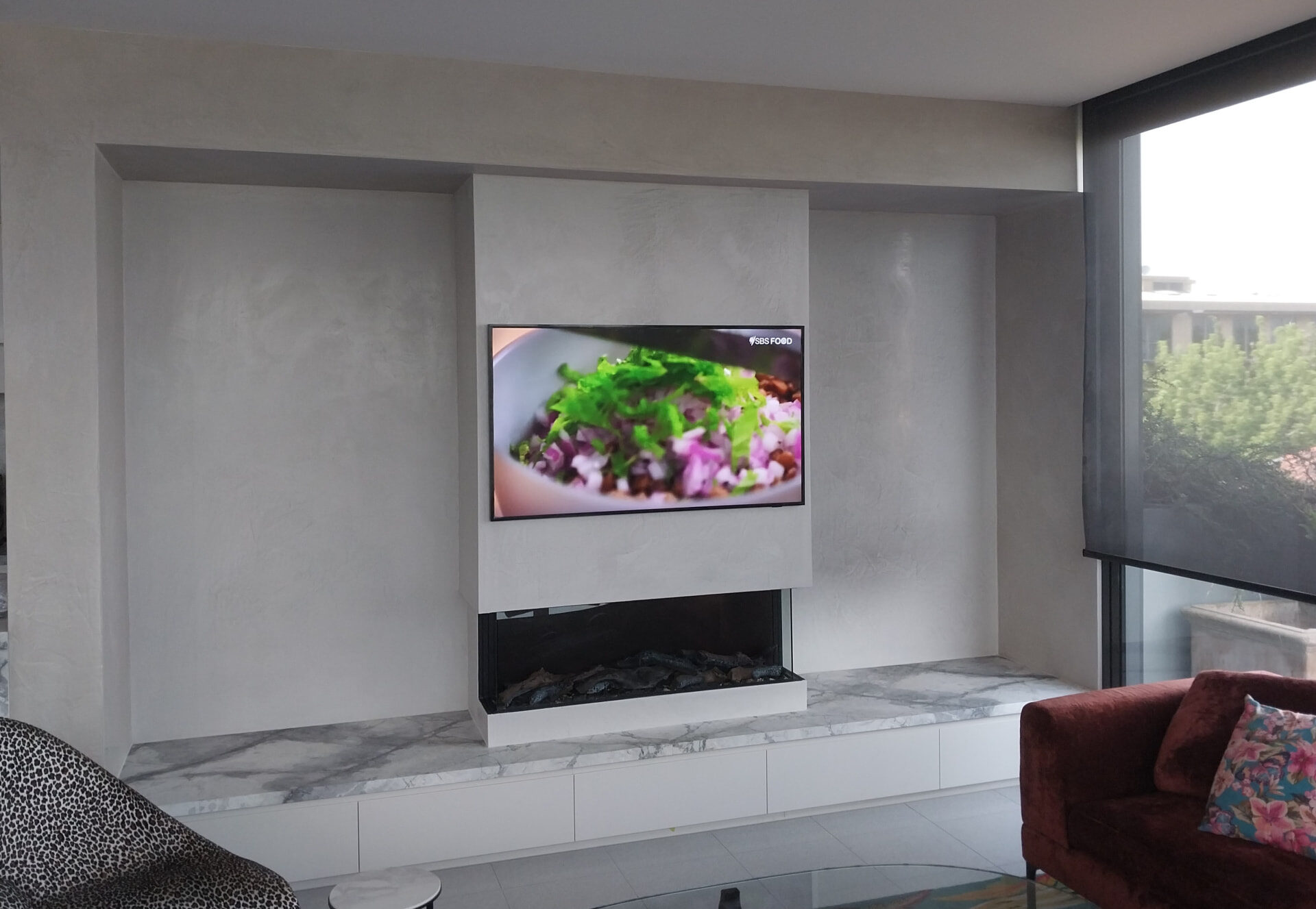 Venetian plaster media wall with inset fireplace